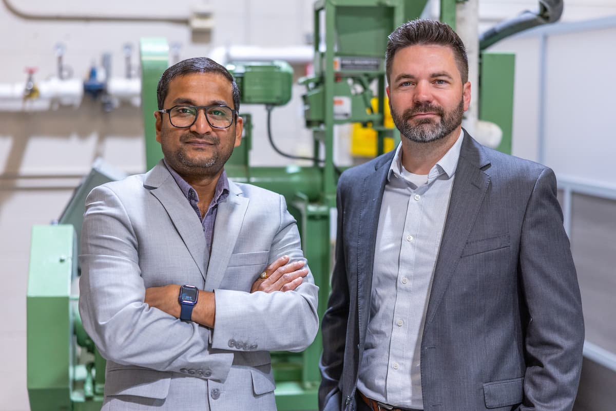 Kyle Anderson and Santanu Bakshi standing together in an industrial research environment.